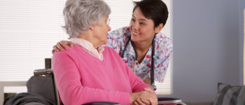 elderly in a wheelchair with her companion