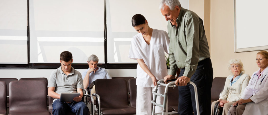 an elderly in a walker with his companion