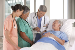 doctor checking the health of an elderly man