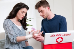 nurse cleaning her wound