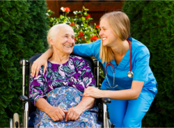 elderly woman in a wheelchair with her companion